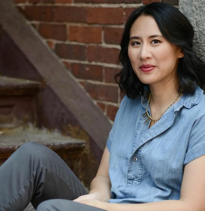 Celeste Ng sitting near stairs